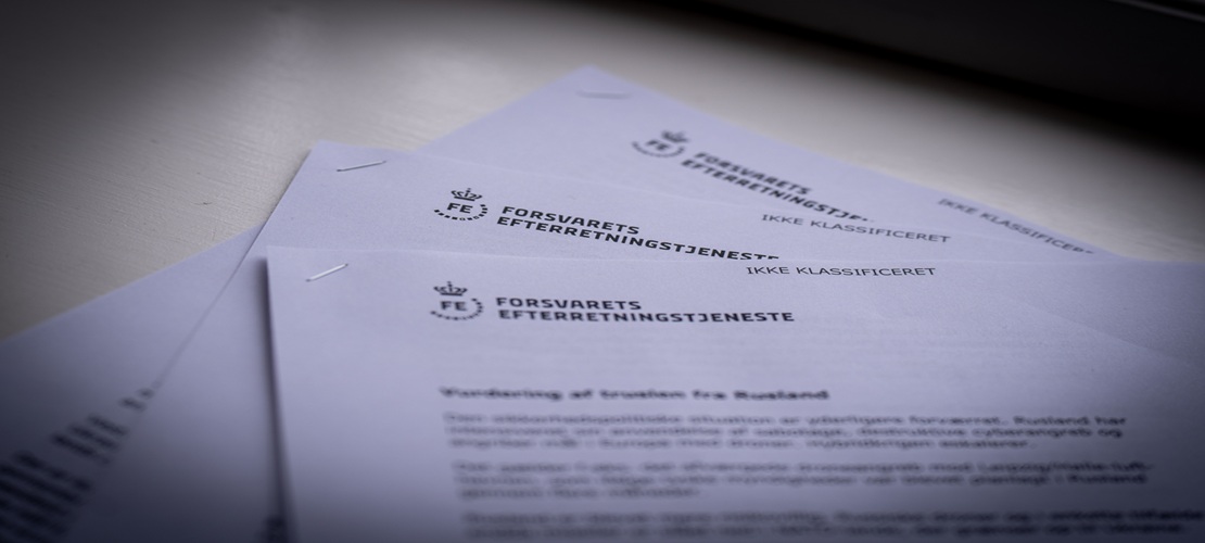 Close-up of three documents on a table
